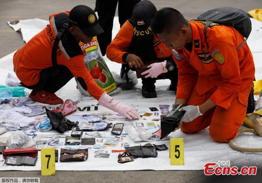 Rescue workers lay out recovered belongings believed to be from the crashed Lion Air flight JT610 at Tanjung Priok port in Jakarta, Indonesia, Oct. 30, 2018. Indonesia on Tuesday stepped up a search for an airliner that plunged into the sea with all 189 aboard feared dead, deploying underwater beacons to trace its black box recorders and uncover why an almost-new plane crashed minutes after take-off. (Photo: China News Service/Lin Yongchuan)