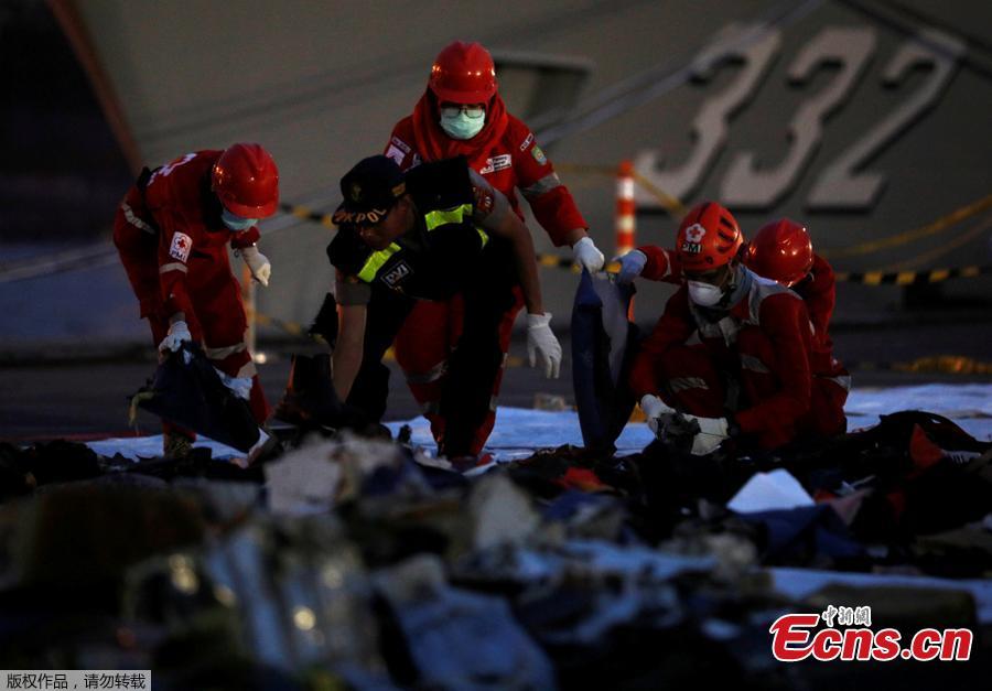 Rescue workers of the crashed Lion Air flight JT610 sort out newly recovered debris at Tanjung Priok port in Jakarta, Indonesia, Oct. 30, 2018. The search continued Tuesday for bodies and the \