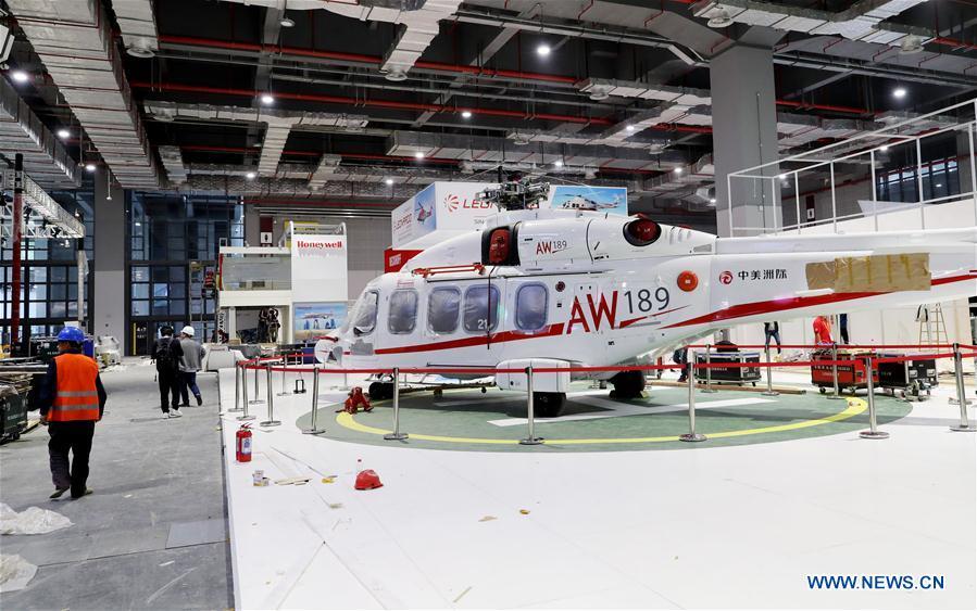 An AW189 helicopter from Italian Leonardo S.p.A. is seen at an exhibition hall in the National Exhibition and Convention Center (Shanghai) in Shanghai, east China, on Oct. 30, 2018. The final work is underway to get all eight exhibition halls ready for the first China International Import Expo (CIIE), scheduled to be held from Nov. 5 to 10. (Xinhua/Fang Zhe)