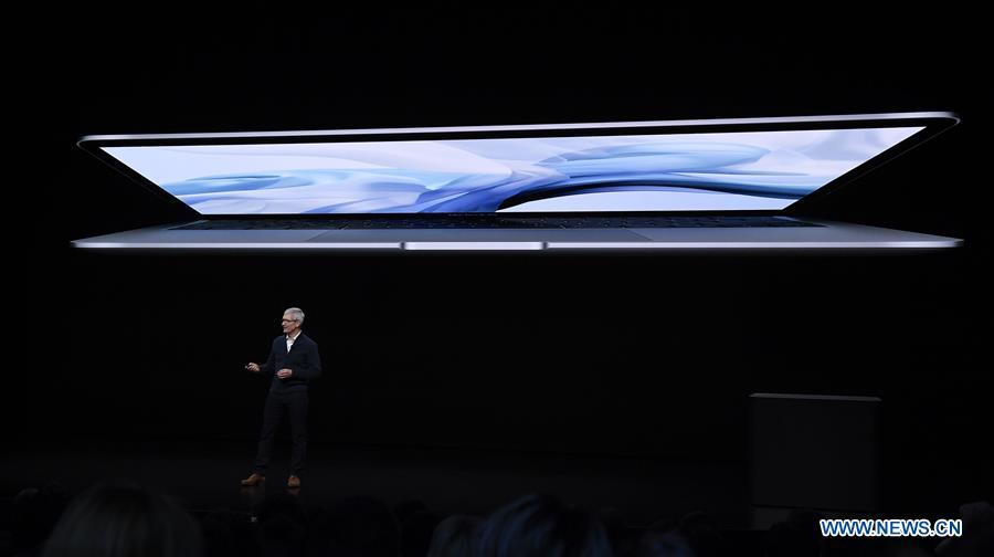 Apple CEO Tim Cook unveils a new MacBook Air during an Apple launch event in Brooklyn, New York, the United States, on Oct. 30, 2018. (Xinhua)