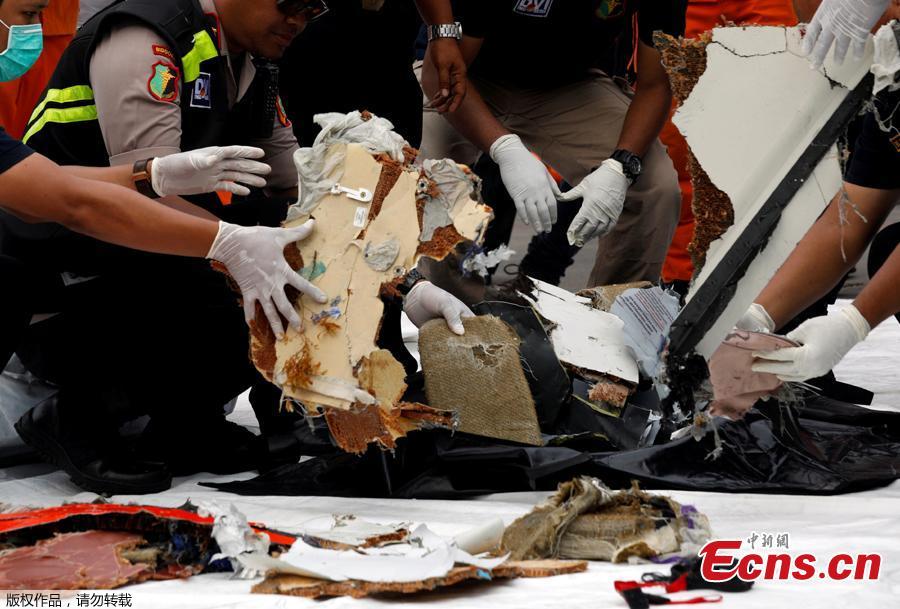 Rescue workers lay out newly recovered debris of Lion Air flight JT610 at Tanjung Priok port in Jakarta, Indonesia, Oct. 30, 2018. The search continued Tuesday for bodies and the \