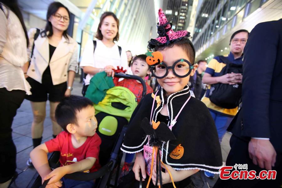 People dressed in Halloween costumes celebrate the western festival at Lan Kwai Fong in Hong Kong on October 31, 2018. (Photo: China News Service/Hong Shaokui)