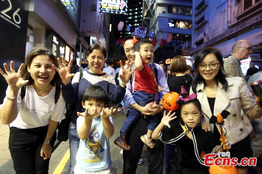 People dressed in Halloween costumes celebrate the western festival at Lan Kwai Fong in Hong Kong on October 31, 2018. (Photo: China News Service/Hong Shaokui)