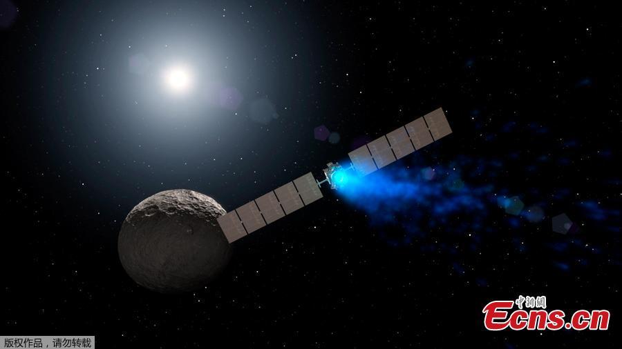 This NASA artist\'s concept obtained November 1, 2018 shows NASA\'s Dawn spacecraft arriving at the dwarf planet Ceres (lower right), travelling through space using a technology called ion propulsion, in which ions are accelerated out of an engine, giving the spacecraft thrust, the xenon ions glow with blue light. Dawn, a NASA spacecraft that launched 11 years ago and studied two of the largest objects in the asteroid belt, has ended its mission after running out of fuel, officials said November 1, 2018. Scientists have known for about a month that Dawn was essentially out of its fuel, hydrazine, which kept the spacecraft\'s antennae oriented toward Earth and helped it turn its solar panels to the Sun to recharge. Then, the spacecraft missed scheduled communications with NASA\'s Deep Space Network on Wednesday and Thursday, and the space agency declared it formally dead. (Photo/Agencies)