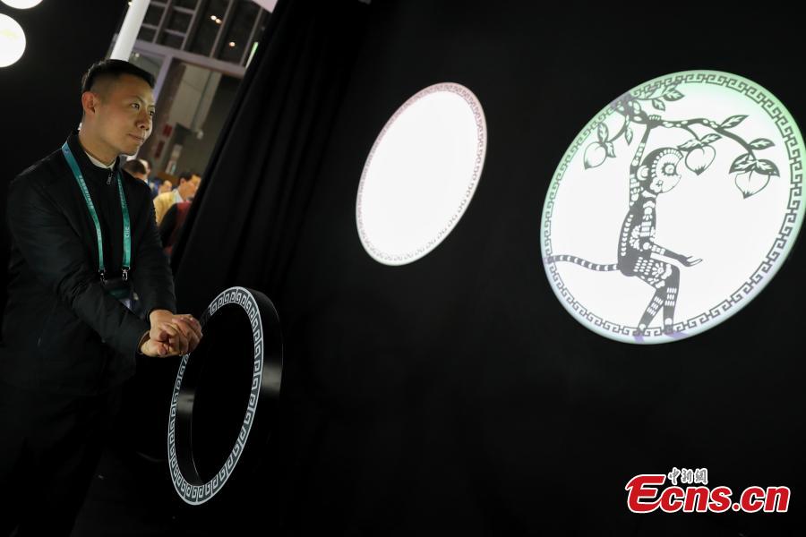 Using TensorFlow, an open source machine learning platform, Google’s ShadowPlay enables visitors to transform shadow figures from hand gestures into digital animations at the first China International Import Expo (CIIE) in Shanghai, east China, Nov. 7 2018. The installation, built using TensorFlow, uses AI to recognize a person’s hand gestures and then magically transform the shadow figure into digital animations representing the 12 animals of the Chinese zodiac and in an interactive show. (Photo: China News Service/Zhang Hengwei)