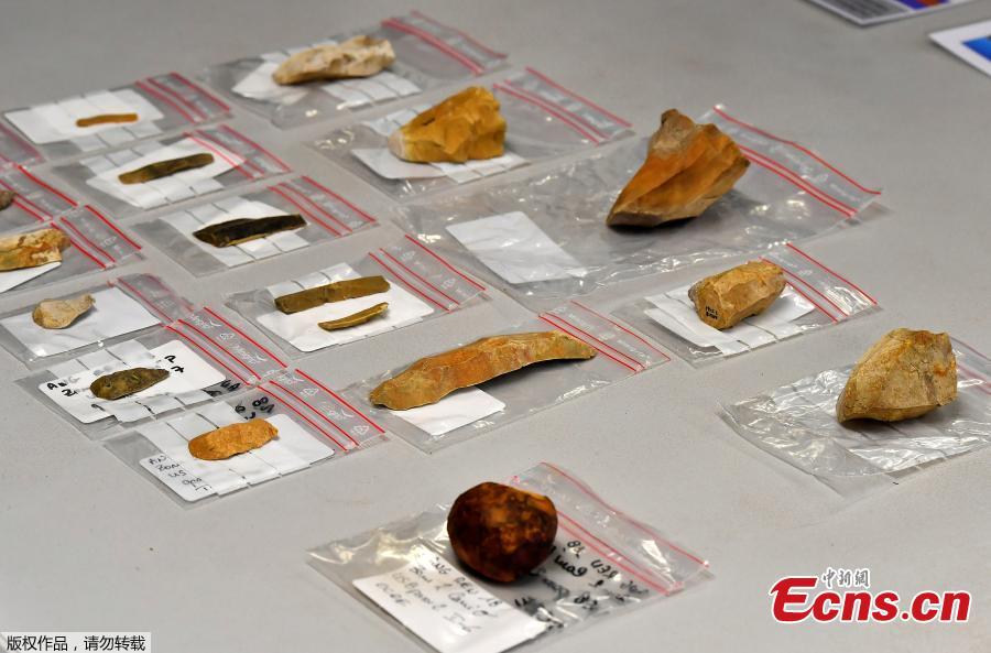 Flints, firing pins, scrapers and other prehistoric items are displayed by archaeologists from INRAP (National Institute of Preventive Archaeological Research) during an excavation of a construction site near the train station of Angouleme, southwest France on November 7, 2018 where important prehistoric discoveries have been made. On this site of some 2,000 square meters, the excavations covers several prehistoric periods starting 11,500 years ago to 8500 years before the Common Era (BCE). (Photo/Agencies)