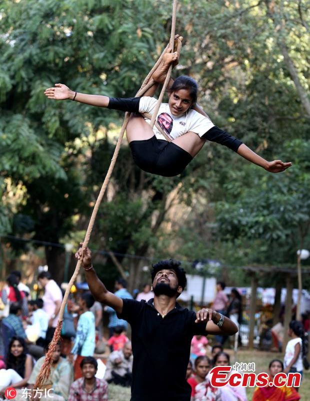 An Indian School child performs rope yoga ahead of children\'s day festival at a park, in Bangalore, India, 10 November 2018. Children\'s day, in India is celebrated every year on 14 November to increase the awareness of people towards the rights, care, and education of children. (Photo/IC)