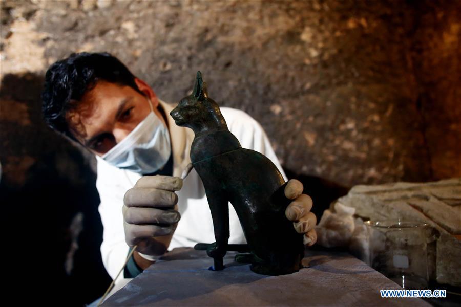 An archeologist works in a tomb in Saqqara Necropolis, Giza Province, Egypt, on Nov. 10, 2018. Egypt\'s Minister of Antiquities Khaled al-Anany announced Saturday the discovery of seven pharaonic tombs in Saqqara Necropolis. (Xinhua/Ahmed Gomaa)