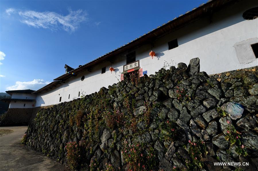 Photo taken on Nov. 11, 2018 shows the external wall of Aijing Zhuang residential complex in Yangwei Village of Yongtai County, southeast China\'s Fujian Province. The project, with a total of 361 rooms covering the area of over 5,200 square meters, was built during the reign of Emperor Daoguang in the Qing Dynasty. It has safeguarded the authentic character of the vernacular housing, defensive structures and waterways that are emblematic of this site, providing a model for other historic villages across China. The conservation of Aijing Zhuang residential complex demonstrates a sensitive approach to sustaining a rural settlement as a living place in harmony with its natural setting. Aijing Zhuang in November this year received the Award of Merit in the 2018 UNESCO Asia-Pacific Awards for Cultural Heritage Conservation. (Xinhua/Zhang Guojun)