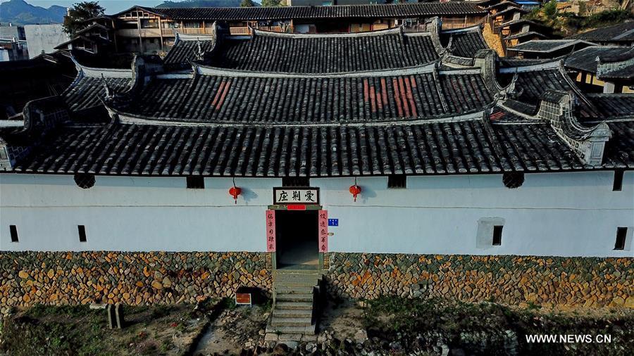 Aerial photo taken on Nov. 11, 2018 shows the scenery of Aijing Zhuang residential complex in Yangwei Village of Yongtai County, southeast China\'s Fujian Province. The project, with a total of 361 rooms covering the area of over 5,200 square meters, was built during the reign of Emperor Daoguang in the Qing Dynasty. It has safeguarded the authentic character of the vernacular housing, defensive structures and waterways that are emblematic of this site, providing a model for other historic villages across China. The conservation of Aijing Zhuang residential complex demonstrates a sensitive approach to sustaining a rural settlement as a living place in harmony with its natural setting. Aijing Zhuang in November this year received the Award of Merit in the 2018 UNESCO Asia-Pacific Awards for Cultural Heritage Conservation. (Xinhua/Zhang Guojun)