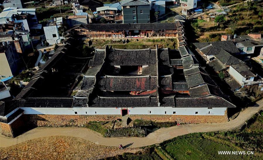 Aerial photo taken on Nov. 11, 2018 shows the scenery of Aijing Zhuang residential complex in Yangwei Village of Yongtai County, southeast China\'s Fujian Province. The project, with a total of 361 rooms covering the area of over 5,200 square meters, was built during the reign of Emperor Daoguang in the Qing Dynasty. It has safeguarded the authentic character of the vernacular housing, defensive structures and waterways that are emblematic of this site, providing a model for other historic villages across China. The conservation of Aijing Zhuang residential complex demonstrates a sensitive approach to sustaining a rural settlement as a living place in harmony with its natural setting. Aijing Zhuang in November this year received the Award of Merit in the 2018 UNESCO Asia-Pacific Awards for Cultural Heritage Conservation. (Xinhua/Zhang Guojun)