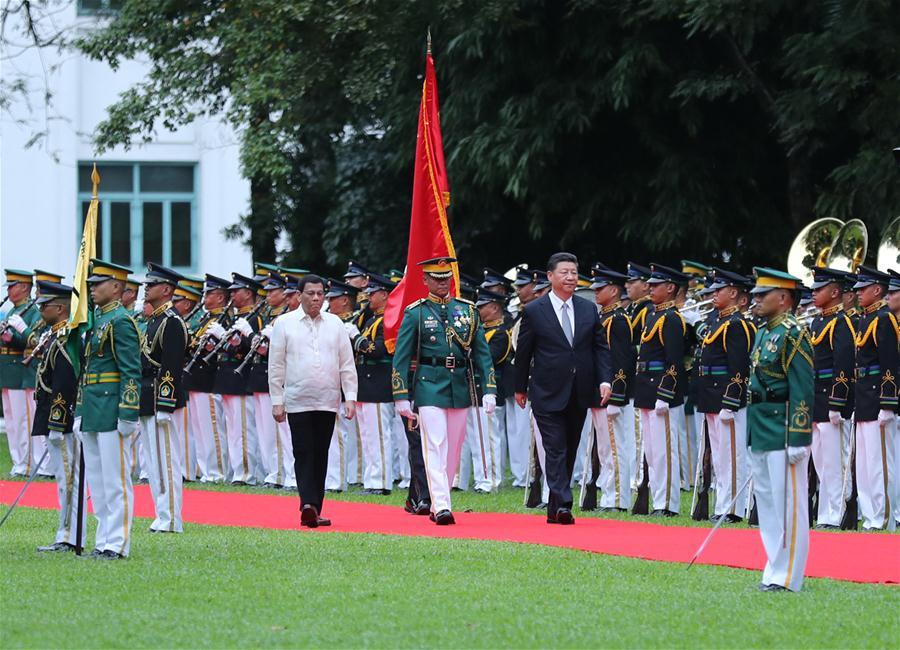 Chinese President Xi Jinping, accompanied by his Philippine counterpart Rodrigo Duterte, inspects the guard of honor in Manila, the Philippines, Nov. 20, 2018. Xi attended a welcome ceremony held by Duterte before their talks on Tuesday. (Xinhua/Ju Peng)