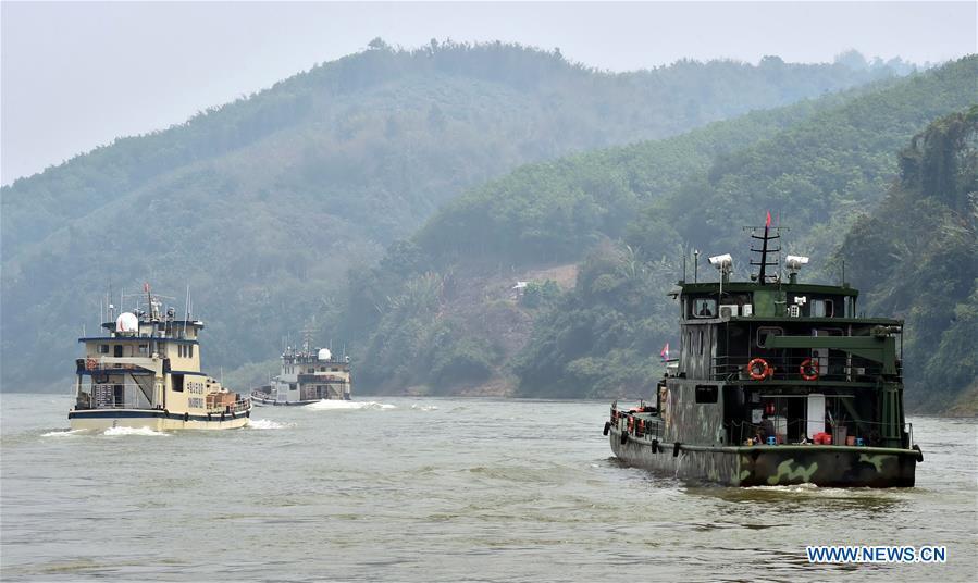 Joint patrol vessels with law enforcement personnel from China, Thailand, Laos and Myanmar, sail on the Lancang-Mekong River, March 17, 2015. The 76th Mekong River joint patrol led by China, Laos, Myanmar, and Thailand started Nov. 20, 2018 from Guanlei Port, Xishuangbanna Dai Autonomous Prefecture in southwest China\'s Yunnan Province. According to Yunnan border police bureau, the joint patrol will last five days and cover a range of over 500 kilometers to enhance anti-terrorism capability, safeguard the security and crack down on cross-border crimes. Once every month since 2011, the patrols targeting drug trafficking, smuggling and other cross-border crimes along the Mekong, conduct random inspections in waters near key regions, including the Golden Triangle.The Mekong River, known as the Lancang River at the Chinese stretch, runs through China, Laos, Myanmar, Thailand, Cambodia and Vietnam. It is an important waterway for transnational shipping and a border area known for criminal activities. For seven years, security cooperation between the four countries has been getting closer with joint patrols a regular monthly phenomenon. The patrol includes anti-terrorism drills, police skill practices and anti-drug campaigns. Since December 2011, the joint patrols have covered more than 39,500 kilometers, with 122 merchant ships rescued and 582.28 kilograms of drugs seized. The cooperation has expanded to the cracking down on terrorism and human trafficking, as well as joint search and rescue. (Xinhua/Chen Haining)
