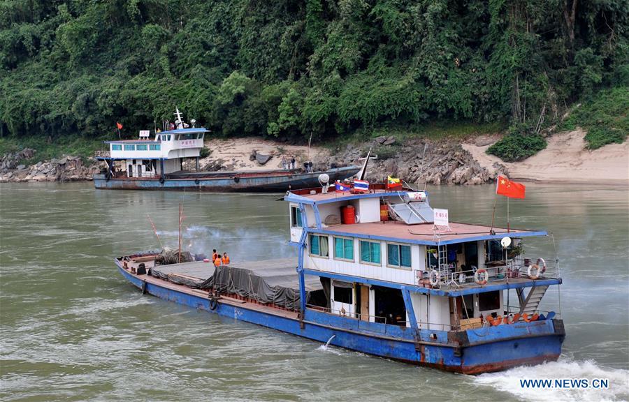 A cargo ship leaves Guanlei Port in Dai Autonomous Prefecture of Xishuangbanna, southwest China\'s Yunnan Province, Dec. 10, 2011, after China, Laos, Myanmar and Thailand commenced a joint police patrol along the Mekong River. The 76th Mekong River joint patrol led by China, Laos, Myanmar, and Thailand started Nov. 20, 2018 from Guanlei Port, Xishuangbanna Dai Autonomous Prefecture in southwest China\'s Yunnan Province. According to Yunnan border police bureau, the joint patrol will last five days and cover a range of over 500 kilometers to enhance anti-terrorism capability, safeguard the security and crack down on cross-border crimes. Once every month since 2011, the patrols targeting drug trafficking, smuggling and other cross-border crimes along the Mekong, conduct random inspections in waters near key regions, including the Golden Triangle.The Mekong River, known as the Lancang River at the Chinese stretch, runs through China, Laos, Myanmar, Thailand, Cambodia and Vietnam. It is an important waterway for transnational shipping and a border area known for criminal activities. For seven years, security cooperation between the four countries has been getting closer with joint patrols a regular monthly phenomenon. The patrol includes anti-terrorism drills, police skill practices and anti-drug campaigns. Since December 2011, the joint patrols have covered more than 39,500 kilometers, with 122 merchant ships rescued and 582.28 kilograms of drugs seized. The cooperation has expanded to the cracking down on terrorism and human trafficking, as well as joint search and rescue. (Xinhua/Lin Yiguang)