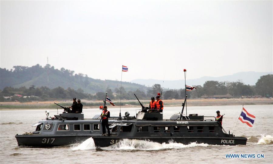 A Thai vessel patrols on the Thailand section of Mekong River, Dec. 11, 2011. The 76th Mekong River joint patrol led by China, Laos, Myanmar, and Thailand started Nov. 20, 2018 from Guanlei Port, Xishuangbanna Dai Autonomous Prefecture in southwest China\'s Yunnan Province. According to Yunnan border police bureau, the joint patrol will last five days and cover a range of over 500 kilometers to enhance anti-terrorism capability, safeguard the security and crack down on cross-border crimes. Once every month since 2011, the patrols targeting drug trafficking, smuggling and other cross-border crimes along the Mekong, conduct random inspections in waters near key regions, including the Golden Triangle.The Mekong River, known as the Lancang River at the Chinese stretch, runs through China, Laos, Myanmar, Thailand, Cambodia and Vietnam. It is an important waterway for transnational shipping and a border area known for criminal activities. For seven years, security cooperation between the four countries has been getting closer with joint patrols a regular monthly phenomenon. The patrol includes anti-terrorism drills, police skill practices and anti-drug campaigns. Since December 2011, the joint patrols have covered more than 39,500 kilometers, with 122 merchant ships rescued and 582.28 kilograms of drugs seized. The cooperation has expanded to the cracking down on terrorism and human trafficking, as well as joint search and rescue. (Xinhua/Lin Ning)