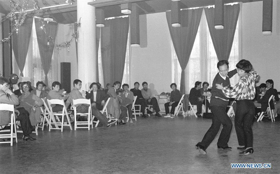 File photo issued on May 6, 1987 shows people dancing in a ballroom in east China\'s Shanghai. From 1978 when China started its reform and opening-up policy, a door to the outside world has been opened. Along with the imported commodities, fashion ideas inevitably slipped into China and since then the country, which was somewhat lack of fashion diversity, started its journey to pursue fashions. Over the past four decades, the thirst for beauty has driven Chinese people to pursue every possible fashionable element. The change first came with dress when colorful and diversified clothing prevailed as against the former dominant blue and grey. For a time, men and women raced to hairdressers\' just for trendy hairdos. Eating McDonald\'s or western cuisine even once was regarded as a fashionable thing. However, the most conspicuous change is that Chinese people have become more inclusive and they tend to accept new fashions, styles and concepts. China nowadays is dazzling the world not only on the fashion stage but in many other fields. Changes in fashions, as a profile of society, has well interpreted the benefits to people brought by China\'s reform and opening-up policy. (Xinhua/Yang Putao)