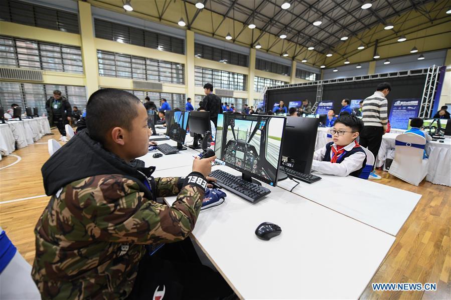 Students compete during the China Junior Flight Simulation Championships in Harbin, northeast China\'s Heilongjiang Province, Nov. 24, 2018. About 411 students of 46 teams took part in the two-day championships. (Xinhua/Wang Song)