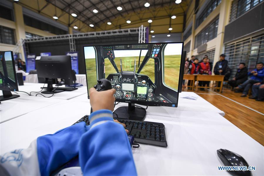 A student competes during the China Junior Flight Simulation Championships in Harbin, northeast China\'s Heilongjiang Province, Nov. 24, 2018. About 411 students of 46 teams took part in the two-day championships. (Xinhua/Wang Song)