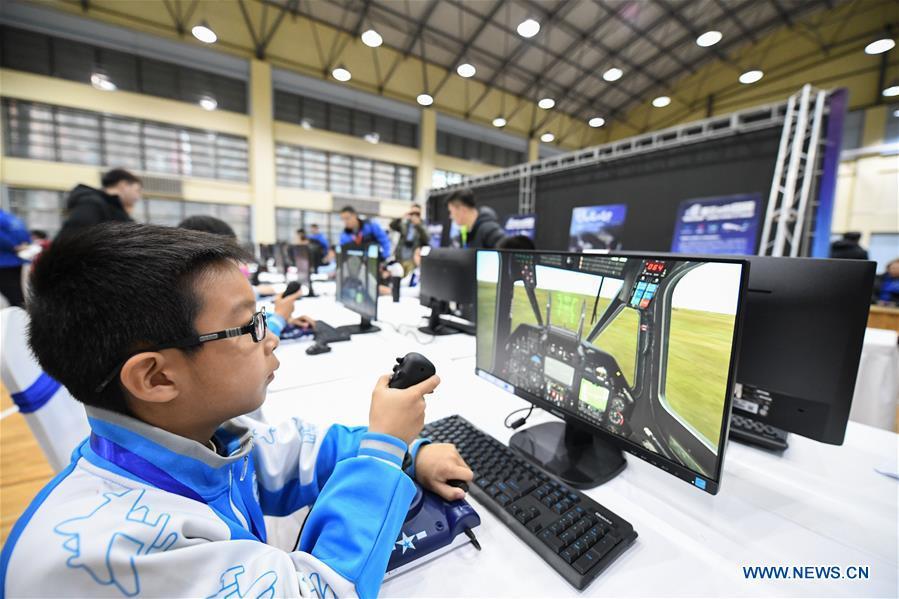 Students compete during the China Junior Flight Simulation Championships in Harbin, northeast China\'s Heilongjiang Province, Nov. 24, 2018. About 411 students of 46 teams took part in the two-day championships. (Xinhua/Wang Song)