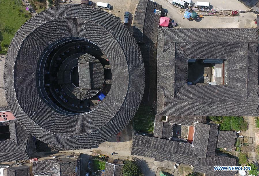 Photo taken on Nov. 23, 2018 shows Huaiyuan Tulou (L) and Fuyuan Tulou in Kanxia Village in Nanjing County of Zhangzhou City, southeast China\'s Fujian Province. Fujian Tulou, which dates back to Song and Yuan dynasties, is a type of Chinese rural dwellings of the Hakka people in the mountainous areas in Fujian Province. The layout of Fujian Tulou followed the Chinese dwelling tradition of \