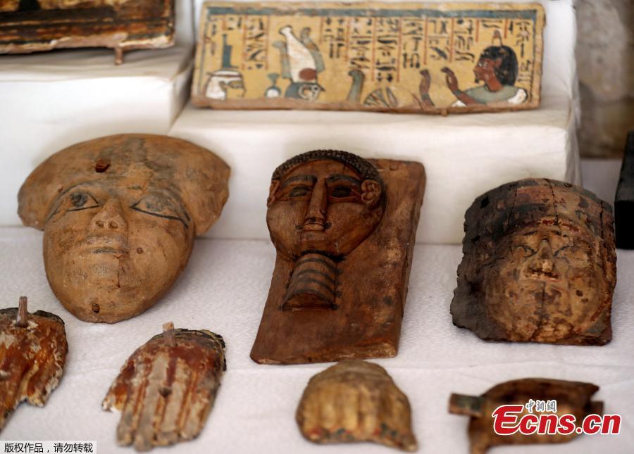 Wooden masks are displayed outside the newly discovered tomb at al-Assassif Necropolis in Luxor, Egypt November 24, 2018.