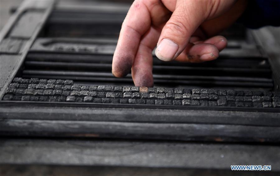 Lei Shitai works in Chanshan Village of Qinxi Town, Jingxian County, in east China\'s Anhui Province, Nov. 23, 2018. Lei, 52, born in neighboring Jiangxi Province, started his career as a typography printer when he finished his apprenticeship with his uncle who he followed since he was 17. The traditional printing method witnessed an increasingly hard time in the recent years as a livelihood. It was in 2017 when he decided to move to Chanshan at the invitation of Kai Yuanhong, a local cabinet maker, to cooperate in a broader way. Lei is now working with the traditional technique in a larger scale. (Xinhua/Zhang Duan)