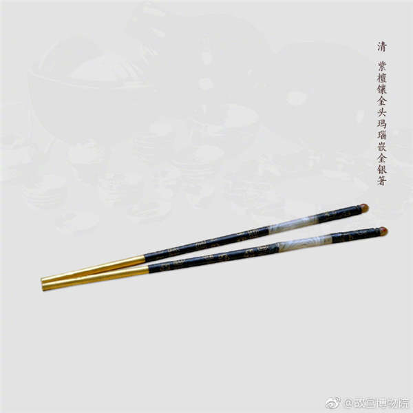 A pair of chopsticks made of red sandalwood inlaid with gold and agate, from the Qing Dynasty. (Photo/Official Weibo account of the Palace Museum)