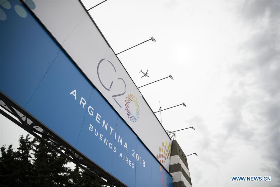 A plane flies above the Costa Salguero Center in Buenos Aires, Argentina, on Nov. 27, 2018. The 13th G20 summit, under the theme of Building Consensus for Fair and Sustainable Development, will be held for the first time in a South American country from Friday to Saturday. (Xinhua/Li Ming)