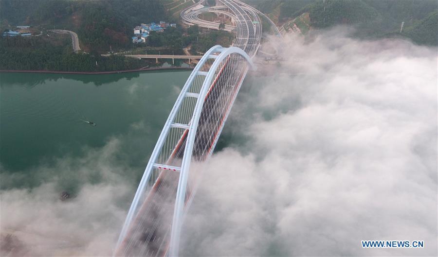 Aerial photo taken on Nov. 27, 2018 shows the Guantang bridge in Liuzhou, south China\'s Guangxi Zhuang Autonomous Region. The bridge, spanning over a distance of 457 meters, opened to traffic on Tuesday. (Xinhua/Li Hanchi)