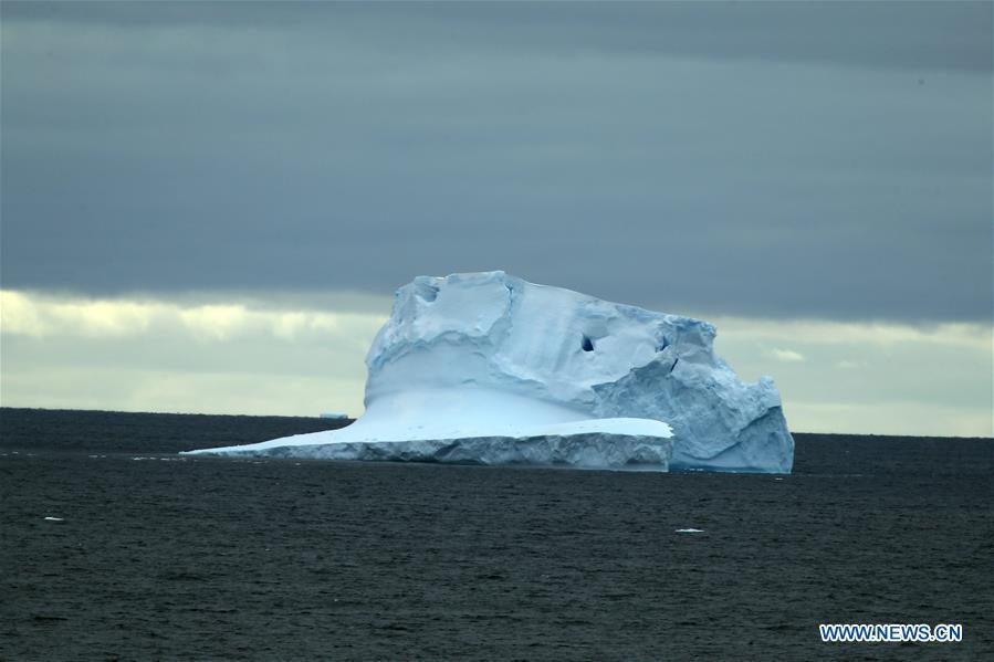 Photo taken on Nov. 27, 2018 shows iceberg seen from China\'s research icebreaker Xuelong in a floating ice area in Southern Ocean. China\'s research icebreaker Xuelong has entered a floating ice area in the Southern Ocean to avoid a cyclone. It is scheduled to reach the Zhongshan Station in Antarctica on Nov. 30. Also known as the Snow Dragon, the icebreaker carrying a research team set sail from Shanghai on Nov. 2, beginning the country\'s 35th Antarctic expedition which will last 162 days and cover 37,000 nautical miles (68,500 km). (Xinhua/Liu Shiping)