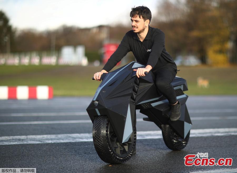 Designer Marco Mattia Cristofori of the German 3D printer manufacturer BigRep, stands with his nearly completely 3D printed e-motorcycle NERA, at the airfield Tempelhof in Berlin, Germany, December 3, 2018.(Photo/Agencies)
