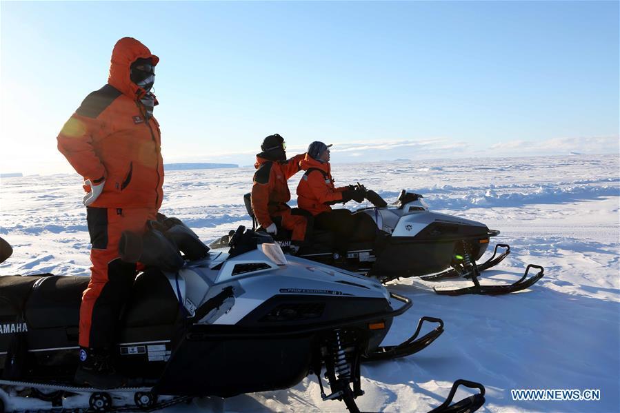 Staff members of the research team drive snowmobiles to detect routes on ice in Antarctica, Nov. 30, 2018. China\'s research icebreaker Xuelong, also known as the Snow Dragon, is now 44 kilometers away from the Zhongshan station. Unloading operations have been carried out after the routes were determined. (Xinhua/Liu Shiping)