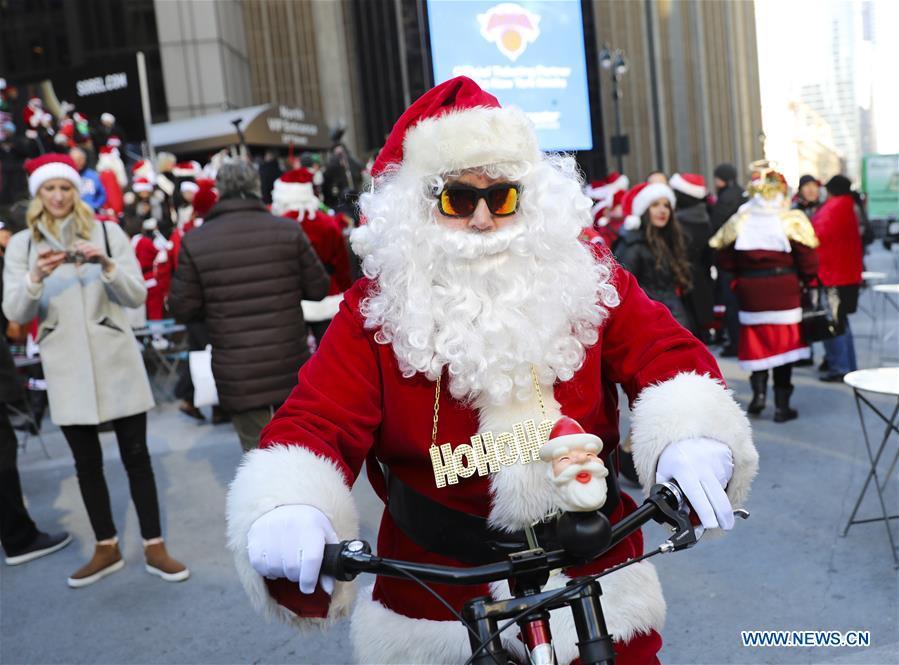 A reveler dressed as Santa Claus takes part in the 2018 SantaCon in New York, the United States, Dec. 8, 2018. Dressed as Santa Claus or in festive costumes, hundreds of People participated in the 2018 SantaCon on Saturday, enjoying the Christmas atmosphere and raising money for charity. (Xinhua/Wang Ying)