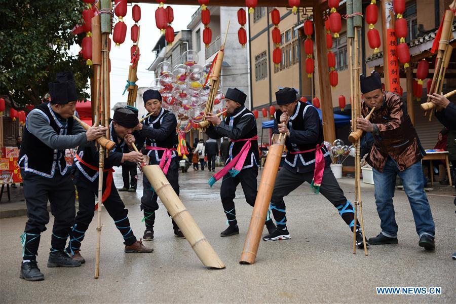People of Dong ethnic group play Lusheng to welcome guests at Jiasuo Dong Village of Zhongchao Township in Liping County, southwest China\'s Guizhou Province, Dec. 9, 2018. Dong people celebrated the new year through various activities on Dec. 7-9. (Xinhua/Yang Wenbin)