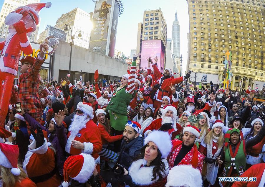 Revelers take part in the 2018 SantaCon in New York, the United States, Dec. 8, 2018. Dressed as Santa Claus or in festive costumes, hundreds of People participated in the 2018 SantaCon on Saturday, enjoying the Christmas atmosphere and raising money for charity. (Xinhua/Wang Ying)