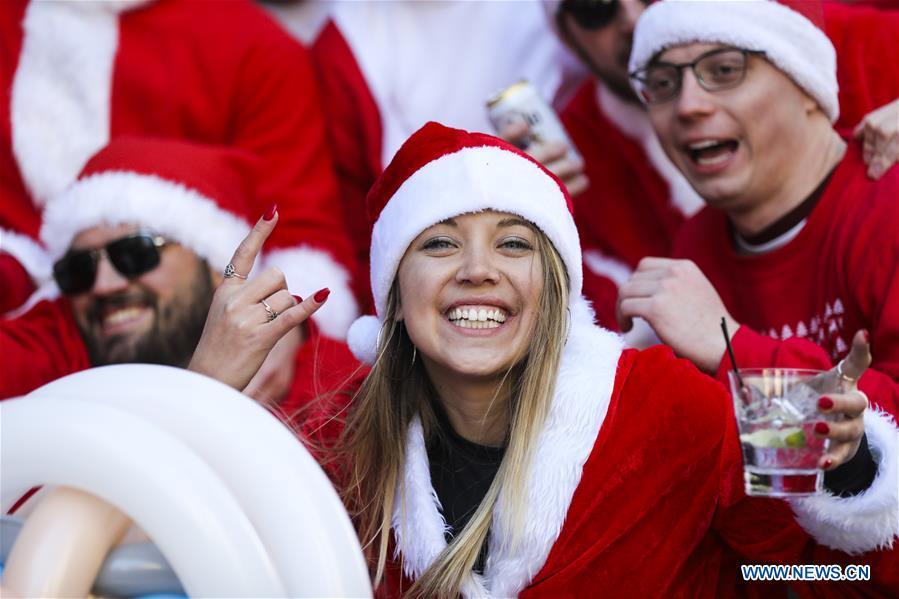 Revelers dressed as Santa Claus take part in the 2018 SantaCon in New York, the United States, Dec. 8, 2018. Dressed as Santa Claus or in festive costumes, hundreds of People participated in the 2018 SantaCon on Saturday, enjoying the Christmas atmosphere and raising money for charity. (Xinhua/Wang Ying)