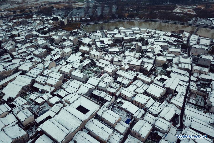 Aerial photo taken on Dec. 9, 2018 shows the snow scenery of Hongcun Village in Yixian County, east China\'s Anhui Province. The cold wave brought snowfall to the village in recent days. (Xinhua/Shi Yalei)