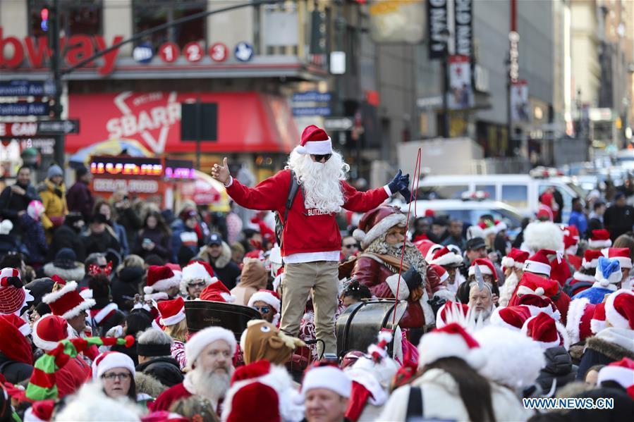 Revelers dressed as Santa Claus take part in the 2018 SantaCon in New York, the United States, Dec. 8, 2018. Dressed as Santa Claus or in festive costumes, hundreds of People participated in the 2018 SantaCon on Saturday, enjoying the Christmas atmosphere and raising money for charity. (Xinhua/Wang Ying)
