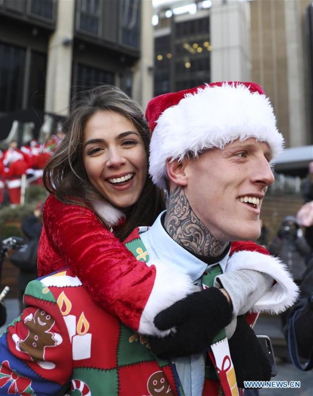 Revelers take part in the 2018 SantaCon in New York, the United States, Dec. 8, 2018. Dressed as Santa Claus or in festive costumes, hundreds of People participated in the 2018 SantaCon on Saturday, enjoying the Christmas atmosphere and raising money for charity. (Xinhua/Wang Ying)