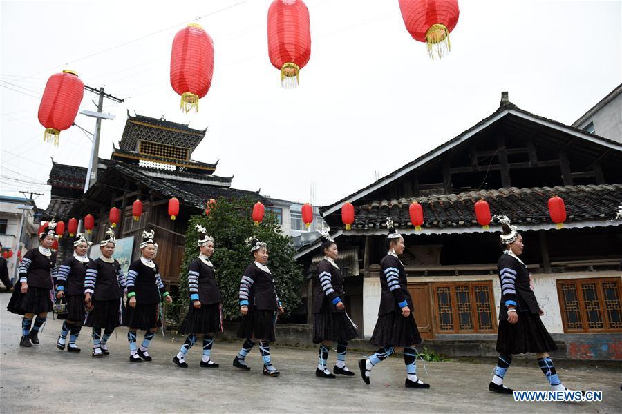 Women dressed in festive costumes attend an activity to celebrate the new year of Dong ethnic group at Jiasuo Dong Village of Zhongchao Township in Liping County, southwest China\'s Guizhou Province, Dec. 9, 2018. Dong people celebrated the new year through various activities on Dec. 7-9. (Xinhua/Yang Wenbin)