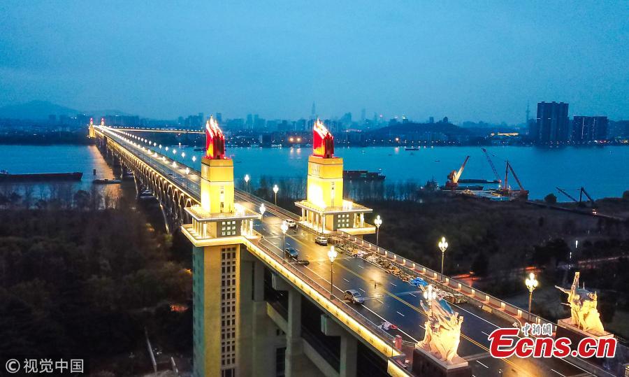 The lighting show at the Nanjing Yangtze River Bridge under renovation in Nanjing City, Jiangsu Province. Renovation of the landmark 50-year-old bridge, which was the first ever Chinese-designed bridge constructed across the Yangtze, is expected to be completed by the end of 2018. The new lighting system is more bright, intelligent and energy-saving, said local authorities. (Photo/VCG)