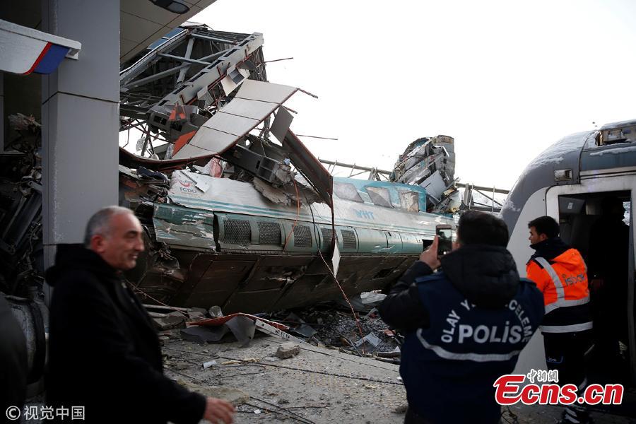 Wreckage of a high speed train is seen after it collides with another locomotive and crashes into an overpass at a train station in Ankara, Turkey, December 13, 2018. Four people were killed and more than 40 injured in the deadly crash, the governor\'s office reported.(Photo/VCG)