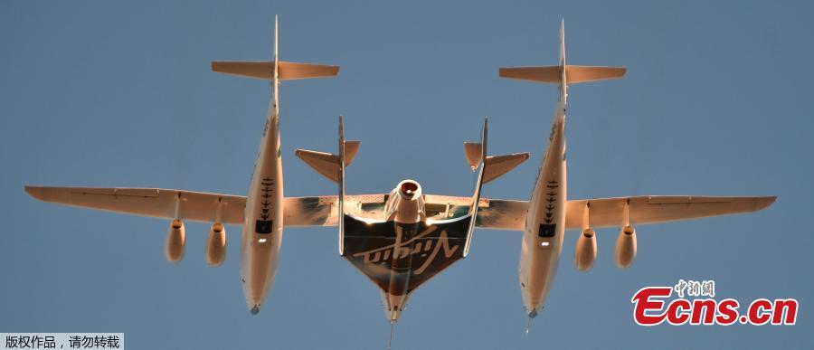 Virgin Galactic\'s SpaceshipTwo takes off for a suborbital test flight of the VSS Unity on December 13, 2018, in Mojave, California. - Virgin Galactic marked a major milestone on Thursday as Unity made it to a peak height, or apogee, of 51.4 miles (82.7 kilometers), after taking off attached to an airplane from Mojave, California, then firing its rocket motors to reach new heights. (Photo/Agencies)