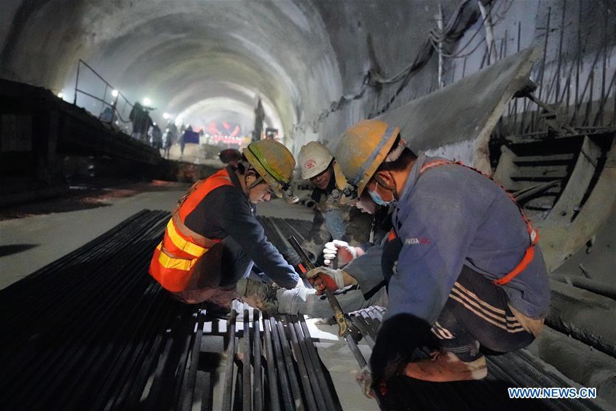 Workers build the New Badaling tunnel of the Beijing-Zhangjiakou high-speed rail line in Beijing, capital of China, Dec. 13, 2018. Workers have achieved a major breakthrough in the Beijing-Zhangjiakou high-speed rail line project, after they dug through the New Badaling tunnel, a pivotal part along the line, on Thursday. (Xinhua/Xing Guangli)