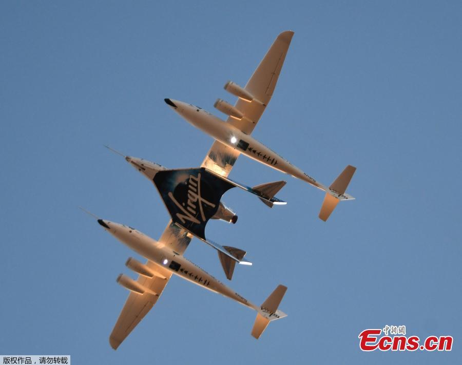Virgin Galactic\'s SpaceshipTwo takes off for a suborbital test flight of the VSS Unity on December 13, 2018, in Mojave, California. Virgin Galactic marked a major milestone on Thursday as Unity made it to a peak height, or apogee, of 51.4 miles (82.7 kilometers), after taking off attached to an airplane from Mojave, California, then firing its rocket motors to reach new heights. (Photo/Agencies)
