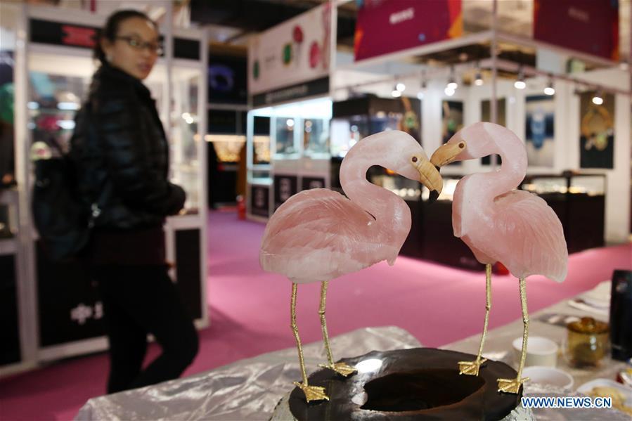 A visitor views exhibits showcased at the 2018 China International Jewelry Fair in Beijing, capital of China, Dec. 13, 2018. Exhibitors from 23 countries and regions attended the fair, opened on Thursday. (Xinhua/Chen Xiaogen)
