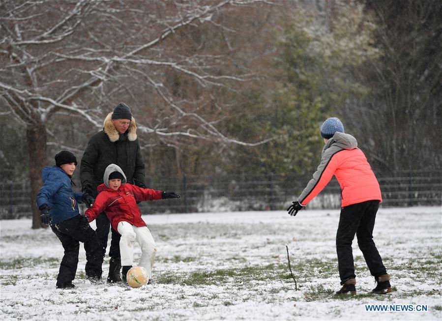 People play soccer at the snow-covered Grueneburg Park in Frankfurt, Germany, on Dec. 16, 2018. A snowfall hit Frankfurt on Sunday. (Xinhua/Lu Yang)