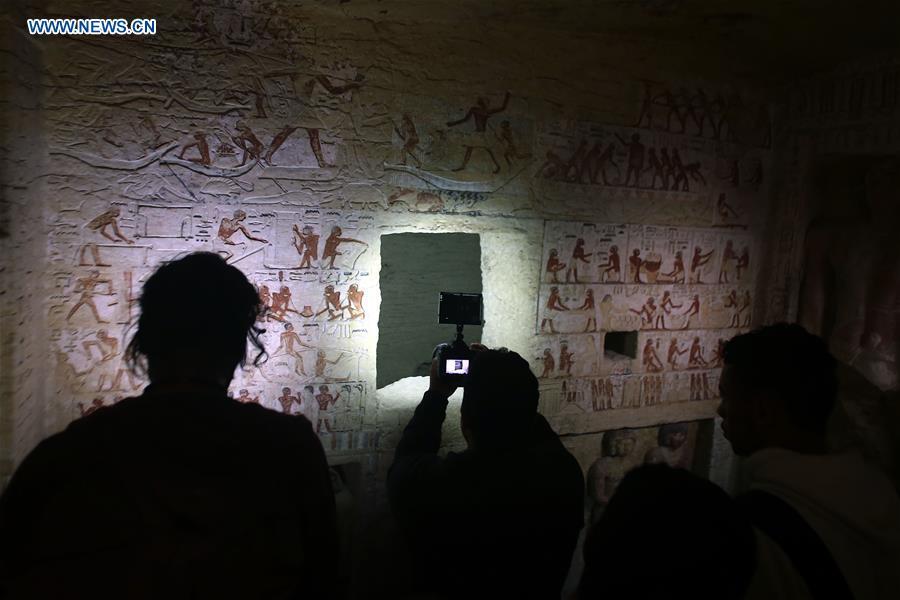 People visit a tomb in Saqqara Necropolis in Giza, Egypt, Dec. 15, 2018. Egyptian Antiquities Minister Khaled al-Anany announced Saturday the discovery of an \
