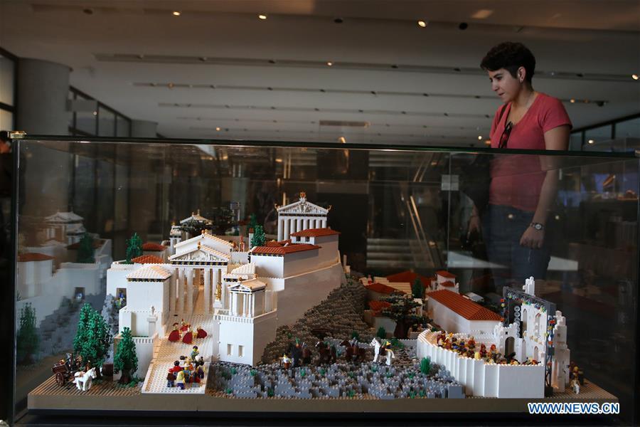 A visitor looks at the Acropolis maquette made with Lego bricks at the Acropolis Museum in Athens, Greece, on Dec. 17, 2018. The Acropolis maquette is a donation from the Nicholson Museum of Sydney. (Xinhua/Marios Lolos)