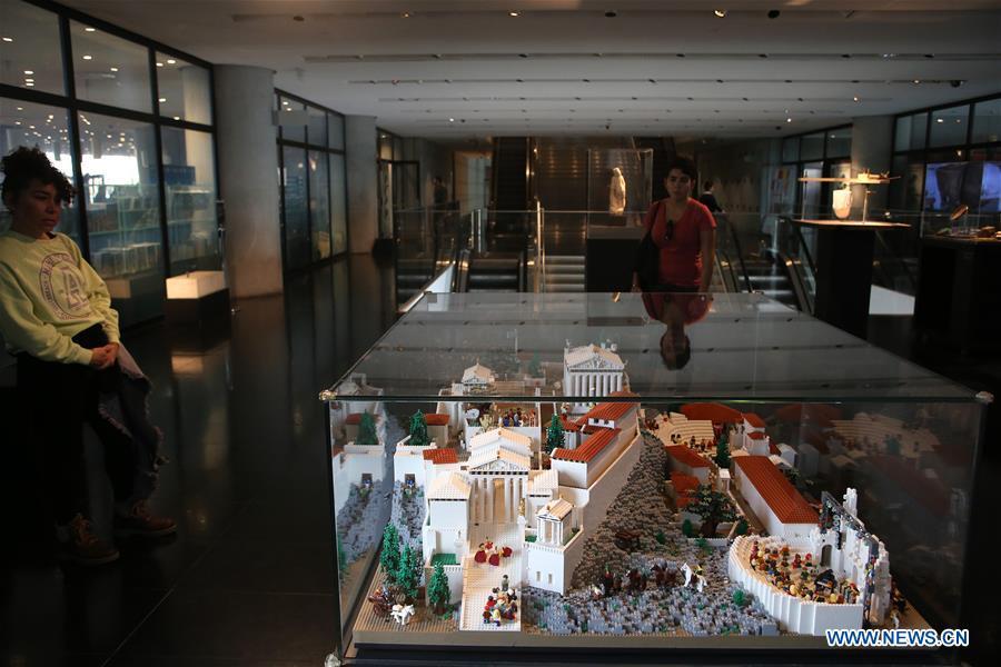 Visitors look at the Acropolis maquette made with Lego bricks at the Acropolis Museum in Athens, Greece, on Dec. 17, 2018. The Acropolis maquette is a donation from the Nicholson Museum of Sydney. (Xinhua/Marios Lolos)